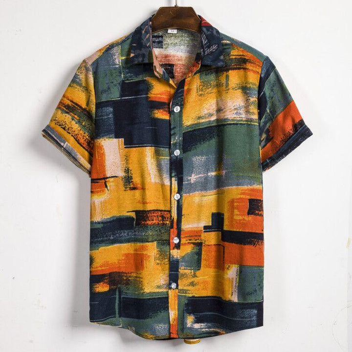 Short sleeve button-up shirt with abstract geometric pattern in yellow, green, orange, and black