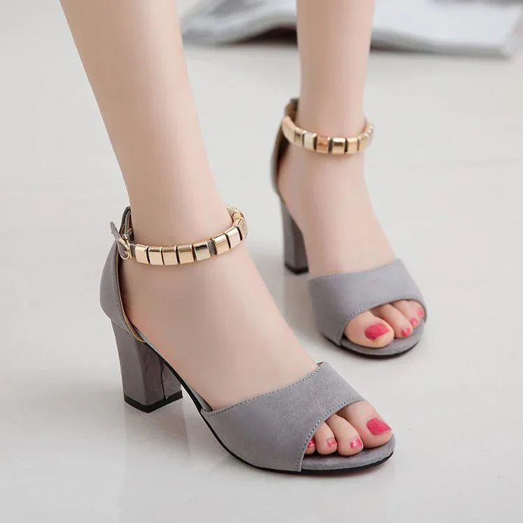 Women's gray suede block heel sandals with gold ankle strap and open toe design