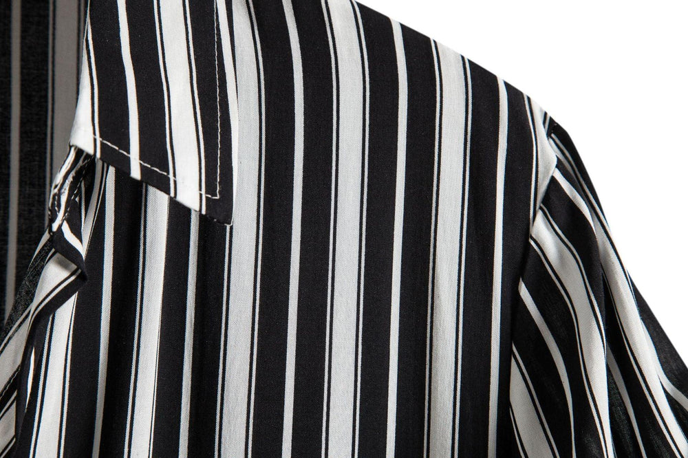 Close-up of black and white vertical striped shirt fabric and collar