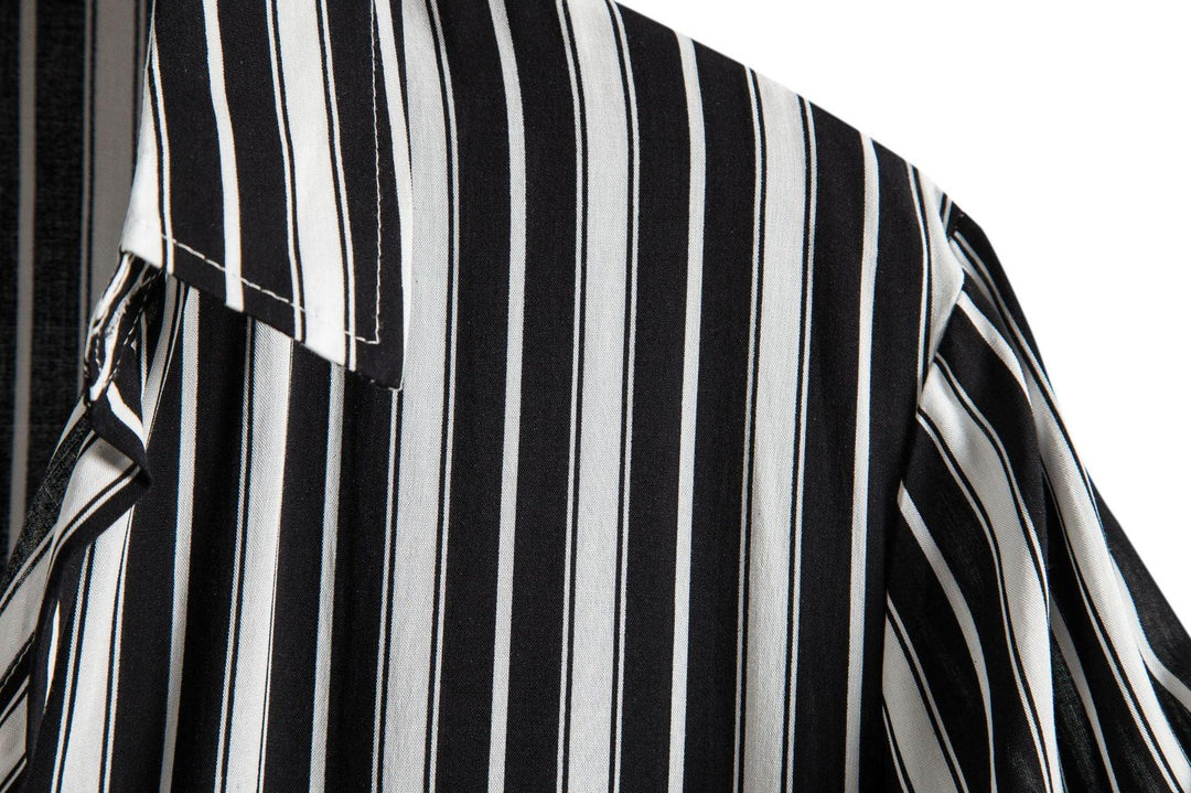 Close-up of black and white vertical striped shirt fabric and collar