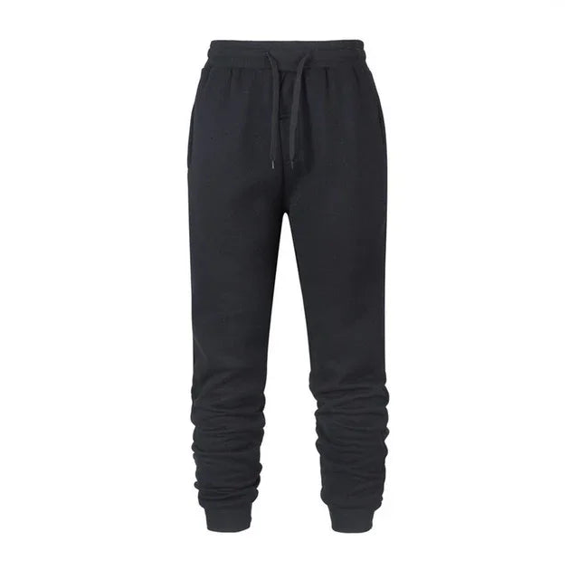Black jogger sweatpants with elastic waistband and drawstring on white background
