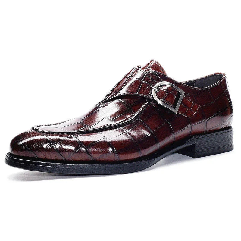Men's brown crocodile pattern leather dress shoe with silver buckle and black sole
