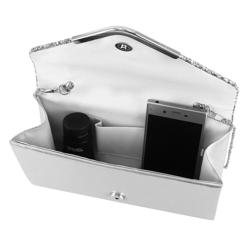 Open white clutch purse with internal compartments holding a smartphone and a black cylindrical item