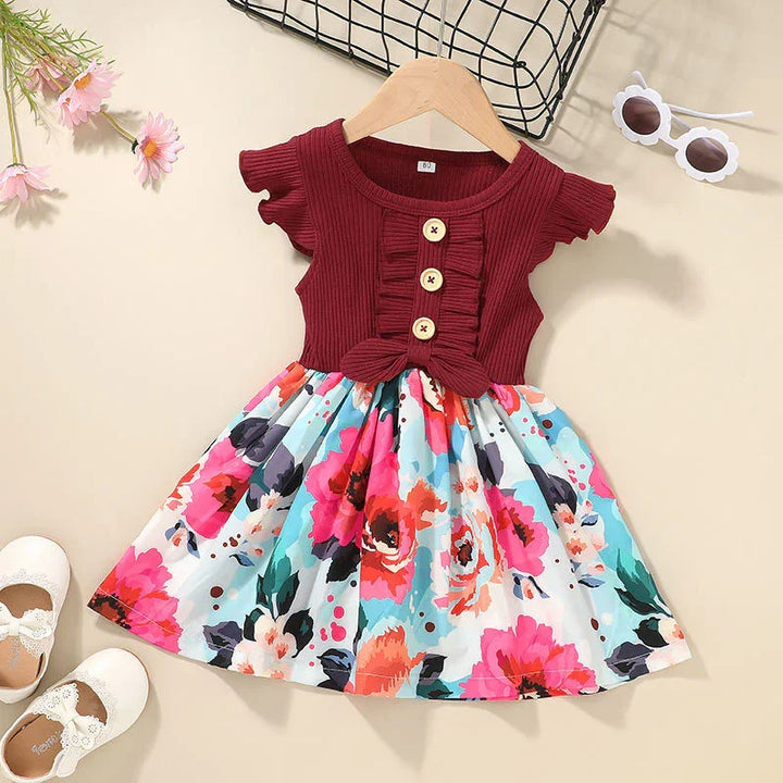 Toddler dress with burgundy ribbed top and colorful floral skirt, wooden buttons, ruffle details