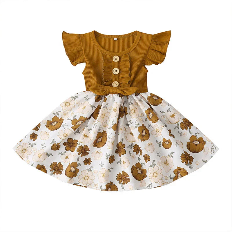 Girls mustard yellow bodice dress with ruffled sleeves, wooden buttons, and white floral skirt