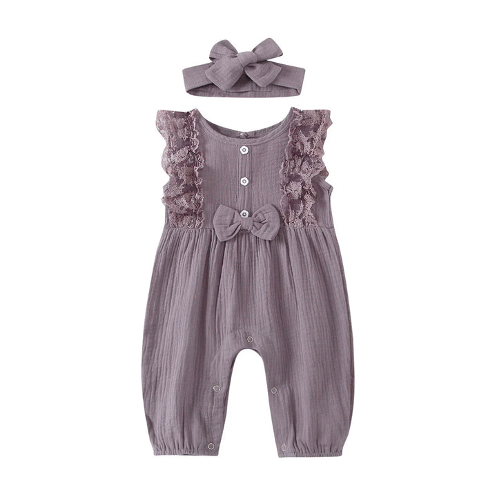 Purple baby romper with lace ruffles, buttons, and matching bow headband on white background