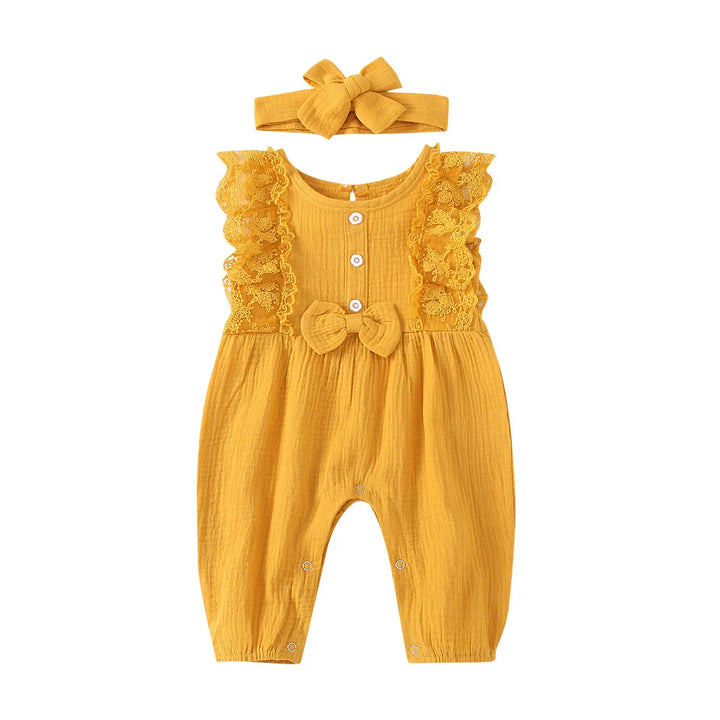 Mustard yellow baby romper with lace sleeves, front buttons, bow detail, and matching headband