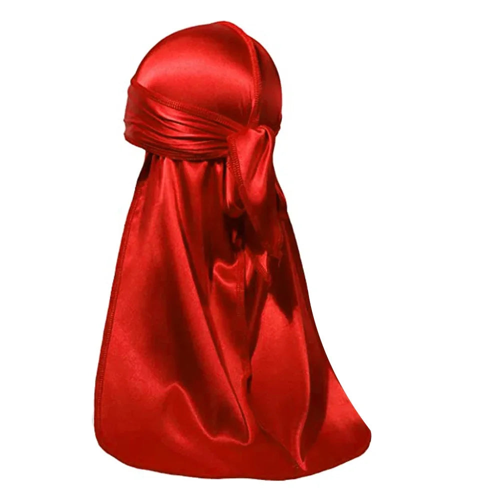 Red satin durag with tied back knot against white background
