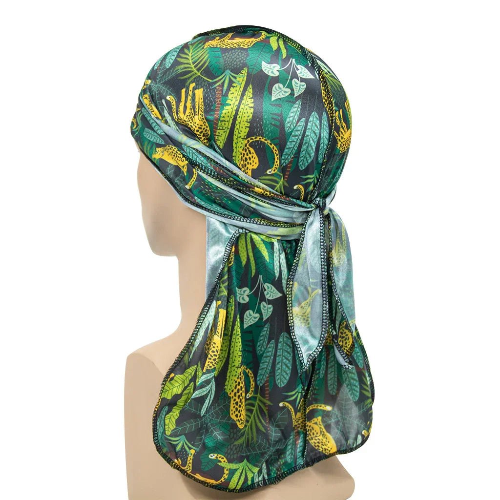 Green and yellow tropical print silk durag with leopard and leaf pattern tied at back