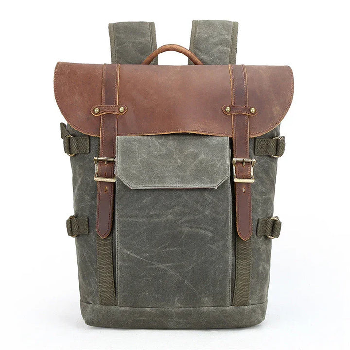 canvas and leather backpack with front pocket and buckle straps in gray and brown