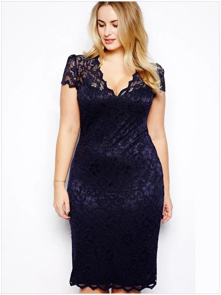 Plus size woman wearing a navy blue lace midi dress with short sleeves and scalloped neckline