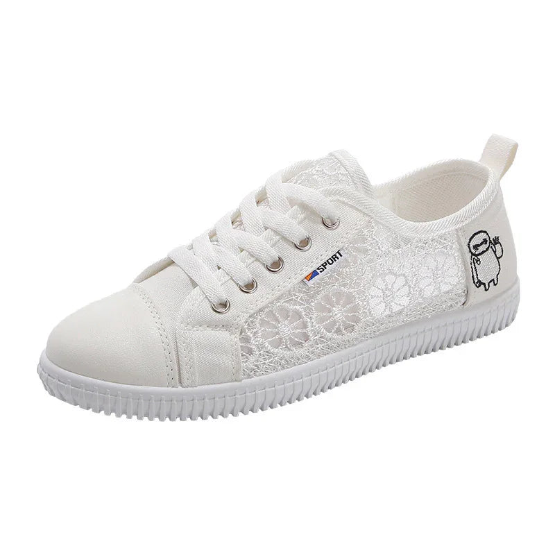 White lace pattern casual sneaker with white laces, rubber sole, and small cartoon patch on heel