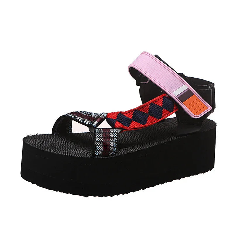 Black platform sandal with red and black patterned strap and pink adjustable ankle strap