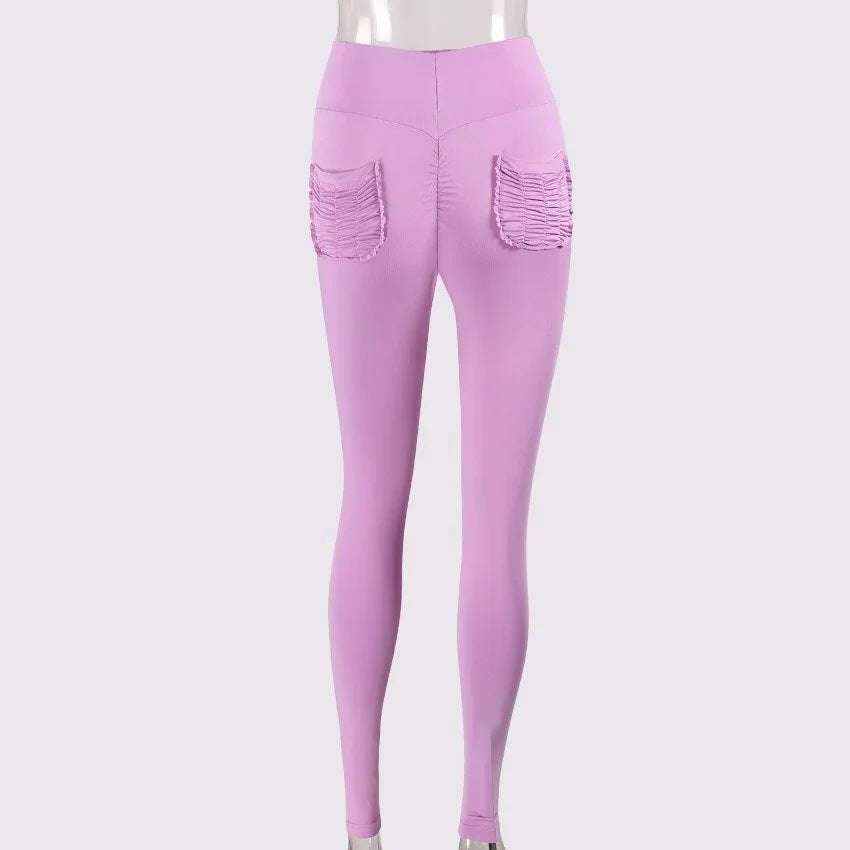 Back view of lilac high-waisted leggings with ruched square pockets on a mannequin