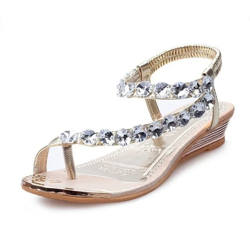 Elegant gold wedge sandal with rhinestone straps and open toe design
