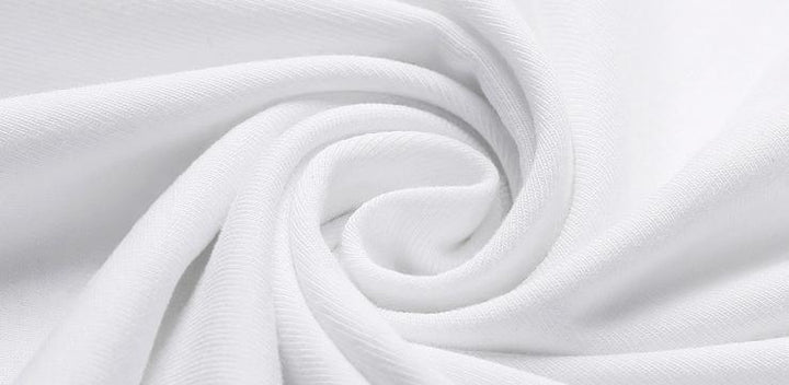 Close-up of soft white cotton fabric twisted in a spiral, showcasing texture and smoothness