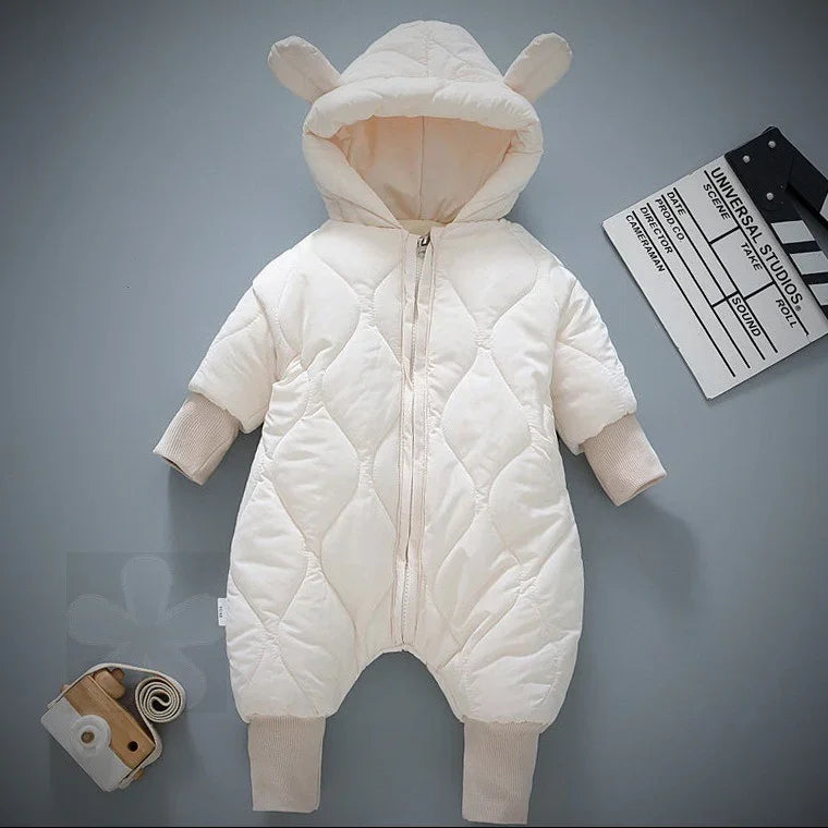 Cream quilted baby jumpsuit with hood and bear ears, ribbed cuffs, and front zipper