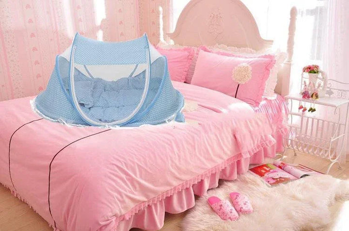Blue baby mosquito net on pink bed with ruffled bedding in bright feminine bedroom