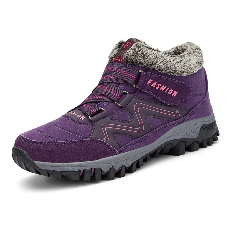 Purple hiking boot with pink accents, faux fur collar, and rugged black sole for winter outdoor use