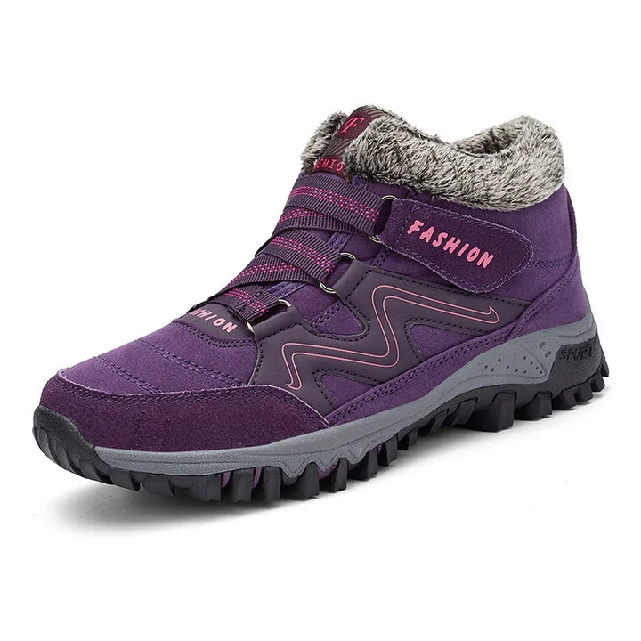 Purple hiking boot with pink accents, faux fur collar, and rugged black sole for winter outdoor use