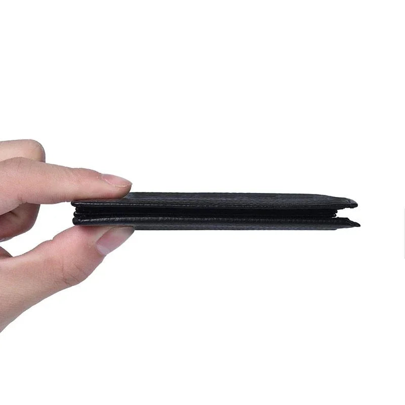 Hand holding slim black leather wallet on white background