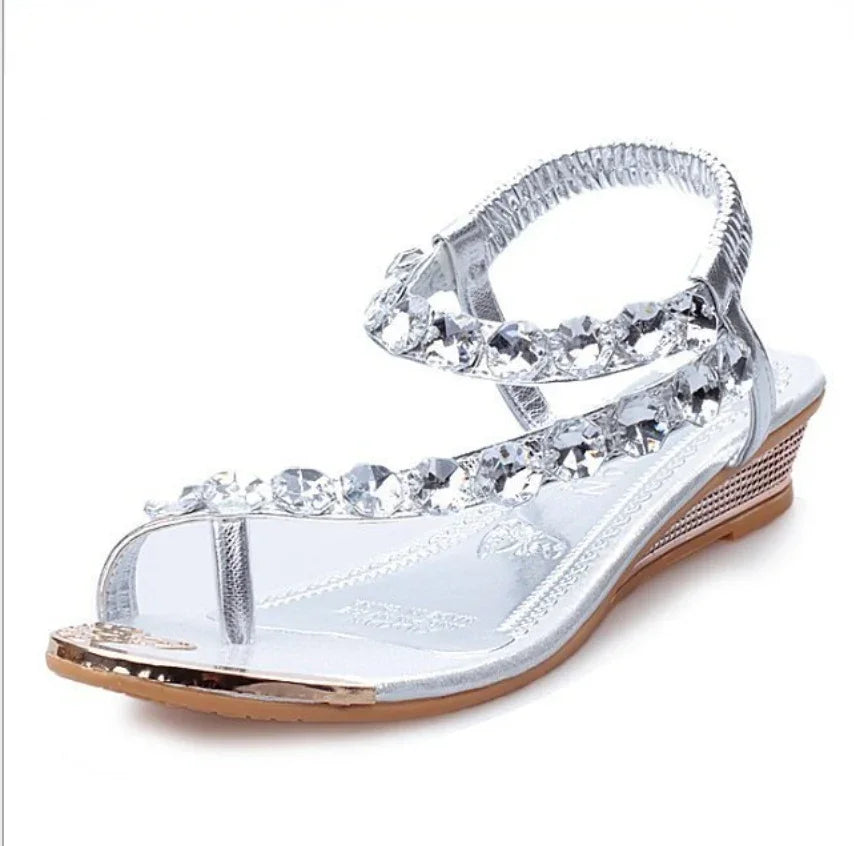 Silver wedge sandal with crystal-embellished straps and open toe design