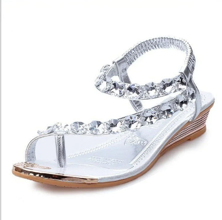 Silver wedge sandal with crystal-embellished straps and open toe design