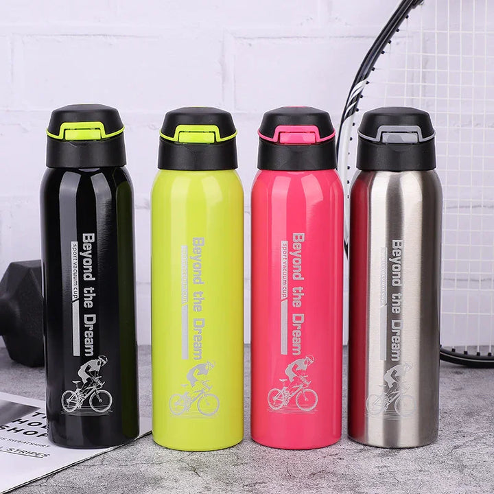 Four Beyond the Dream sports water bottles in black, yellow, pink, and silver on a table