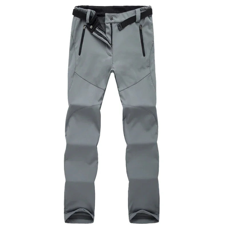 Gray outdoor hiking pants with zipper pockets and adjustable black belt on white background