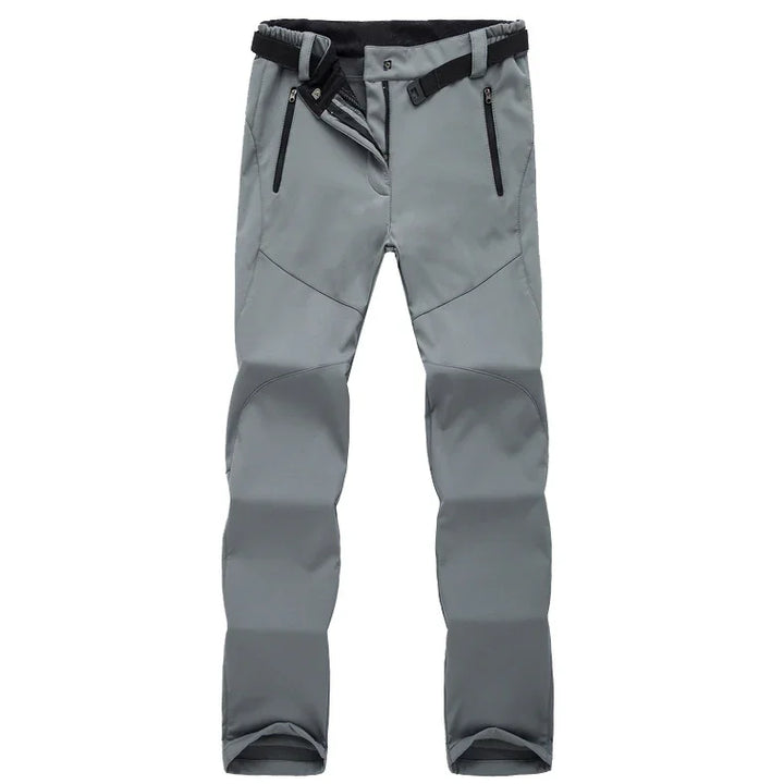 Gray outdoor hiking pants with zipper pockets and adjustable black belt on white background