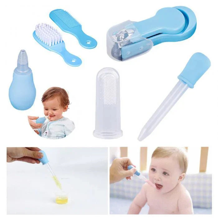 Blue and white baby grooming kit with nail clippers, comb, brush, nasal aspirator, finger toothbrush, and medicine dropper
