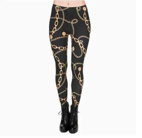 Black leggings with gold chain and coin print paired with black lace-up ankle boots