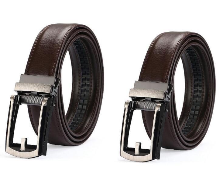 Two brown leather ratchet belts with silver and black automatic buckles on a white background