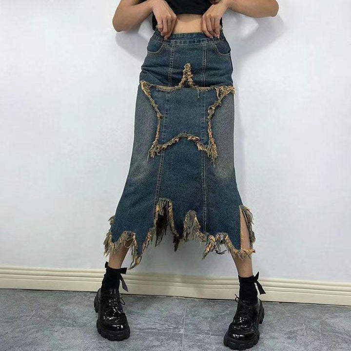 Denim midi skirt with frayed star design and jagged hem paired with black platform shoes and socks