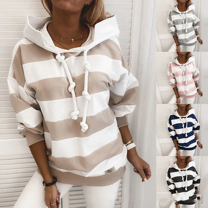 Woman wearing beige and white striped hoodie with thick ropes, styled casual with white pants, shown in four color options