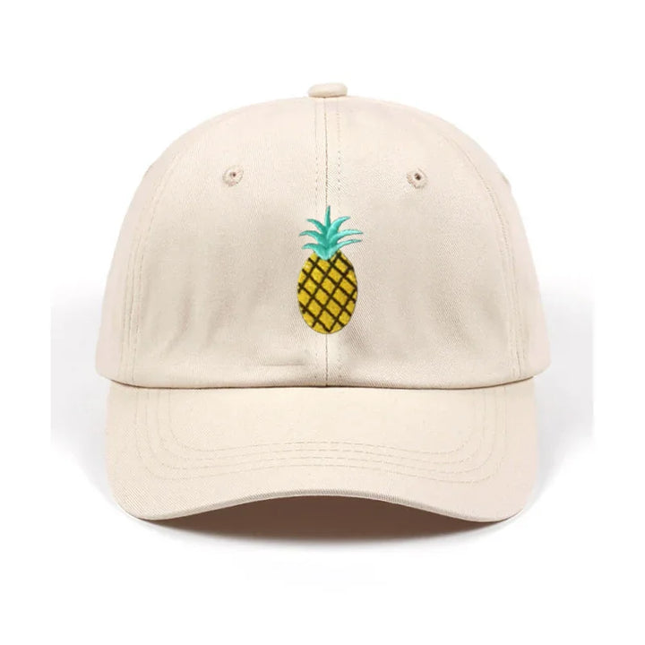 Beige baseball cap with embroidered yellow pineapple and green leaves design