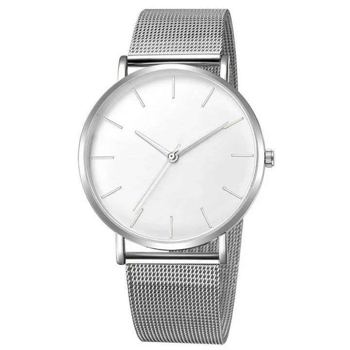 Minimalist silver mesh band wristwatch with white dial and slender hour markers