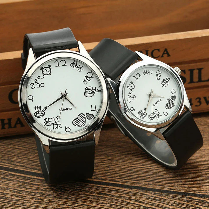 Pair of quartz watches with black leather straps featuring playful doodle hour markers and white dial