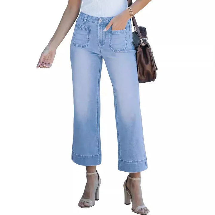 Woman wearing light blue wide-leg cropped jeans with front patch pockets and high heels