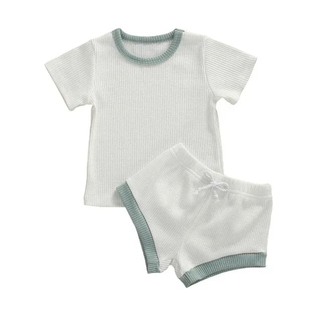 White ribbed short sleeve shirt and shorts set with light blue trim for toddlers