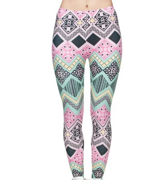 Close-up of colorful geometric patterned leggings with pink, green, black, and beige tones