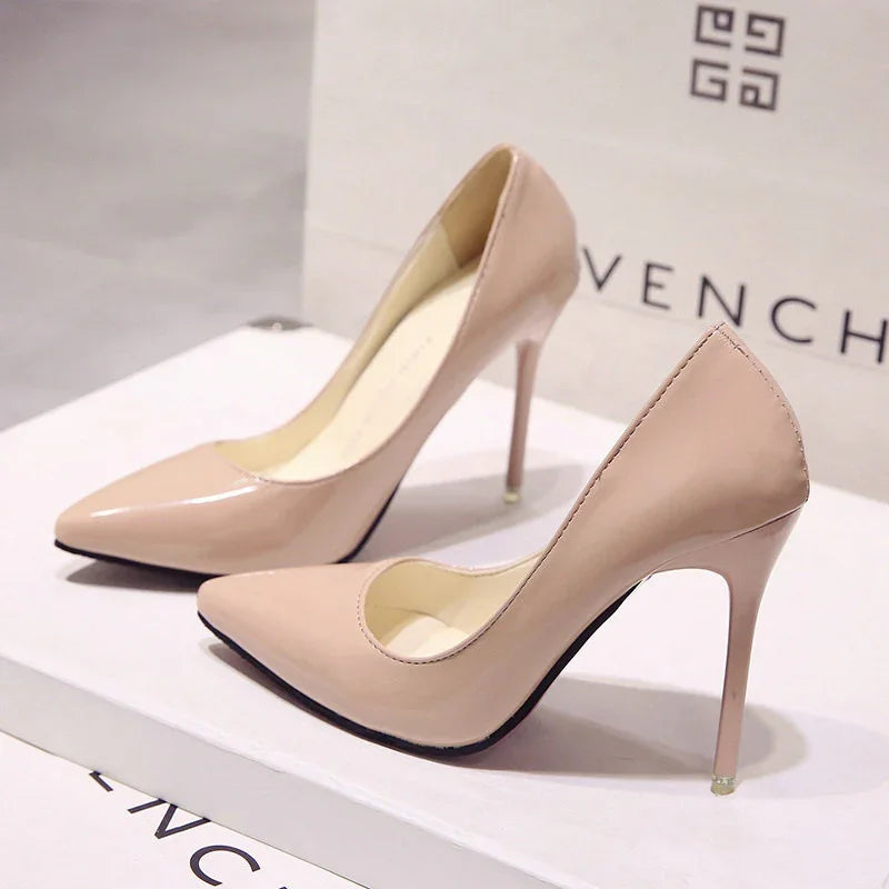 Elegant nude patent leather high heel pumps on white Givenchy branded box