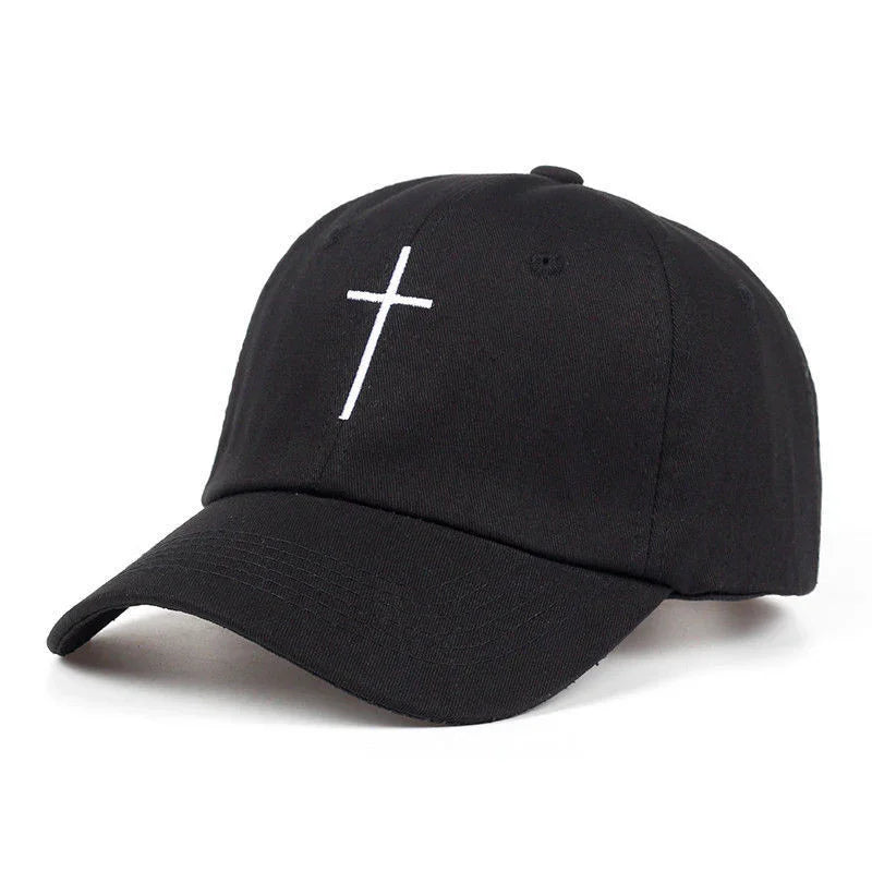 Black baseball cap with white embroidered cross on front, curved brim, and adjustable back