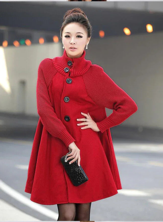 Woman wearing a stylish red wool coat with large black buttons and knit sleeves, holding a black clutch