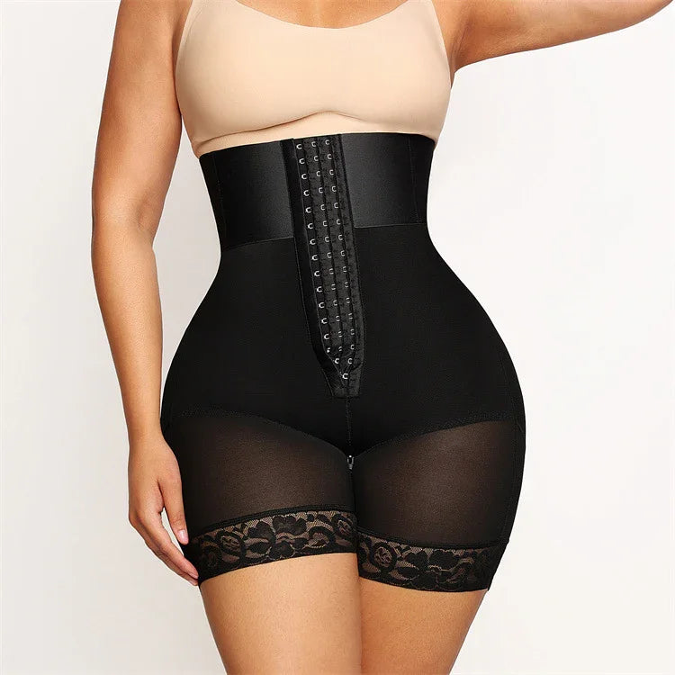 Woman wearing black high-waisted waist trainer shorts with lace trim and hook-and-eye closure