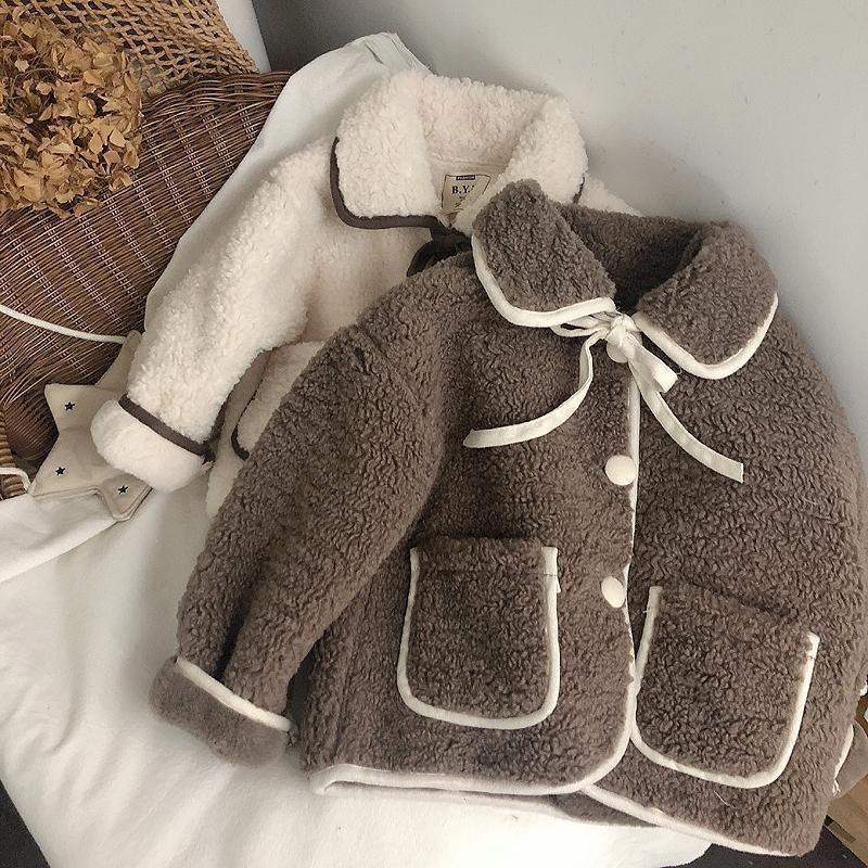 Two cozy sherpa fleece jackets, one brown and one cream, with contrasting trim and button details