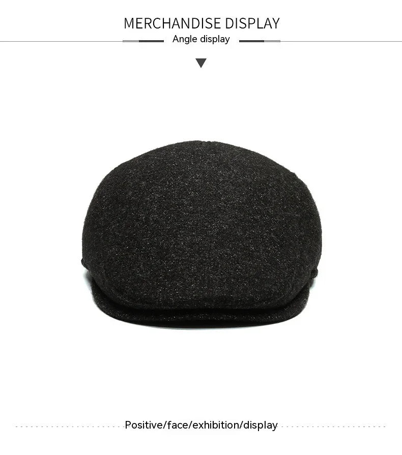 Black wool flat cap displayed on white background, merchandise angle view