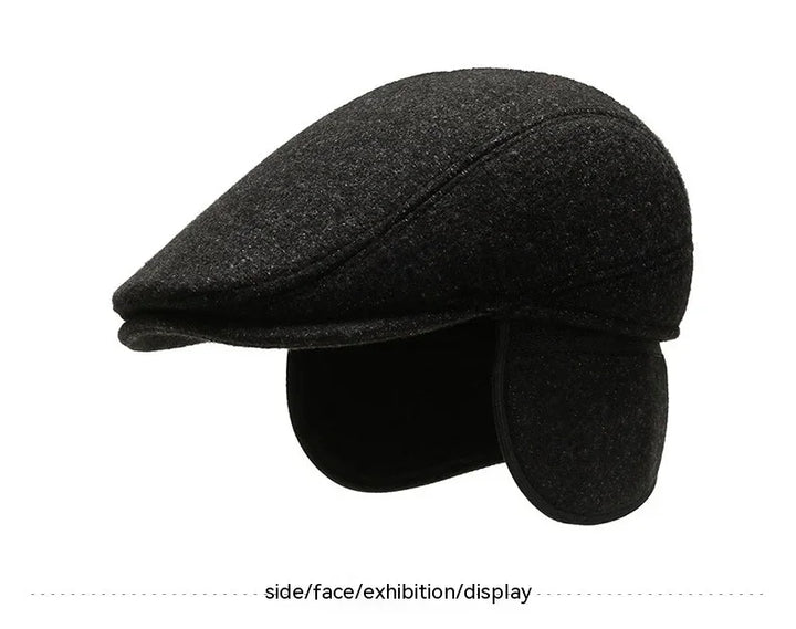 Black wool flat cap with ear flaps, stylish winter hat, isolated on white background