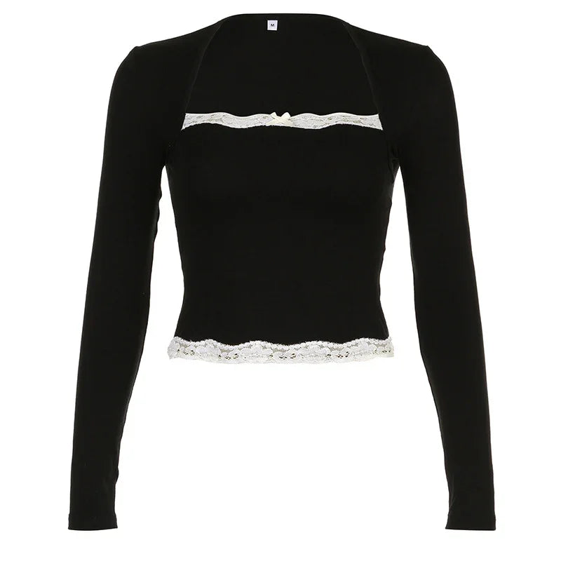 Black long sleeve cropped top with white lace trim and small bow detail