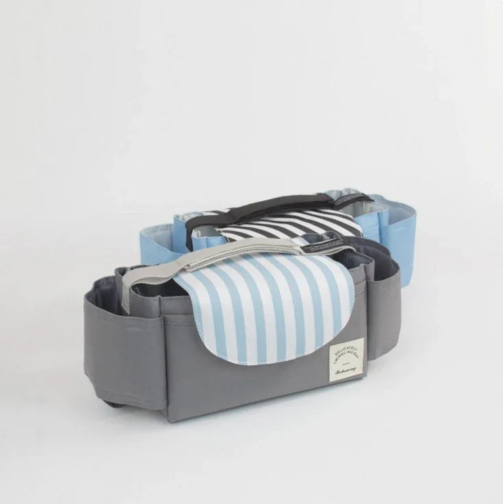 Two fabric organizer bags with side pockets and striped flaps, one light blue and gray, one black and blue